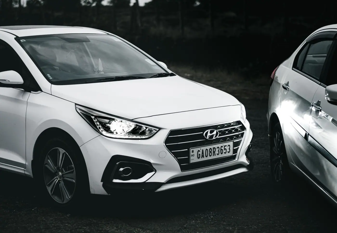 Monochrome image of a Hyundai car with visible license plate. Perfect for automotive themes.