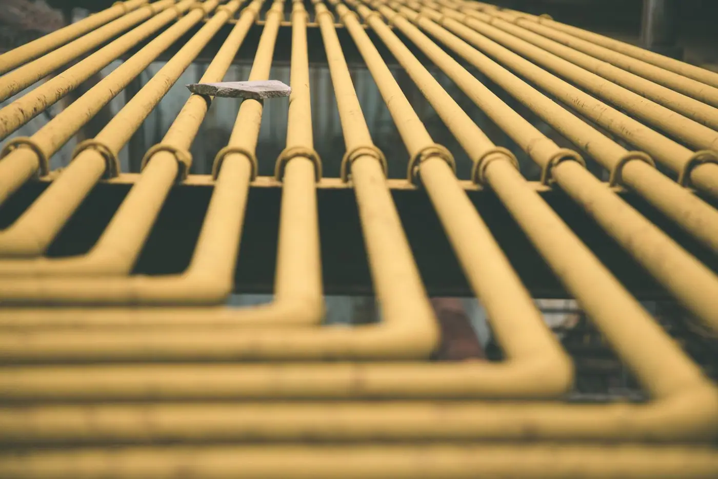 Multiple yellow pipes forming a geometric pattern