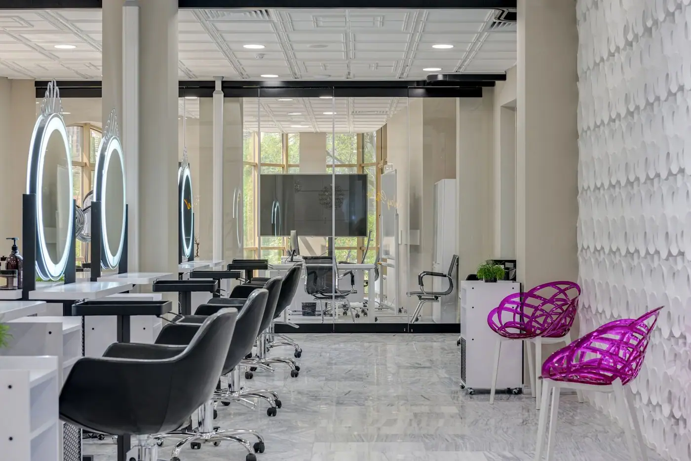 Chic salon space with sleek chairs, mirrors and contemporary decor