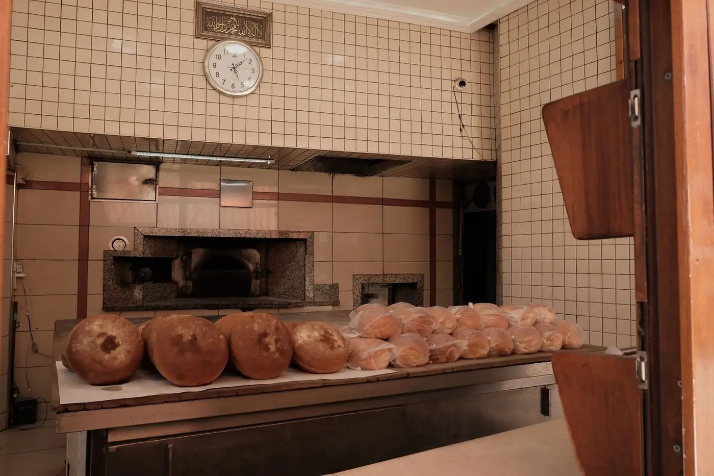 Inside a traditional bakery with fresh bread loaves on display