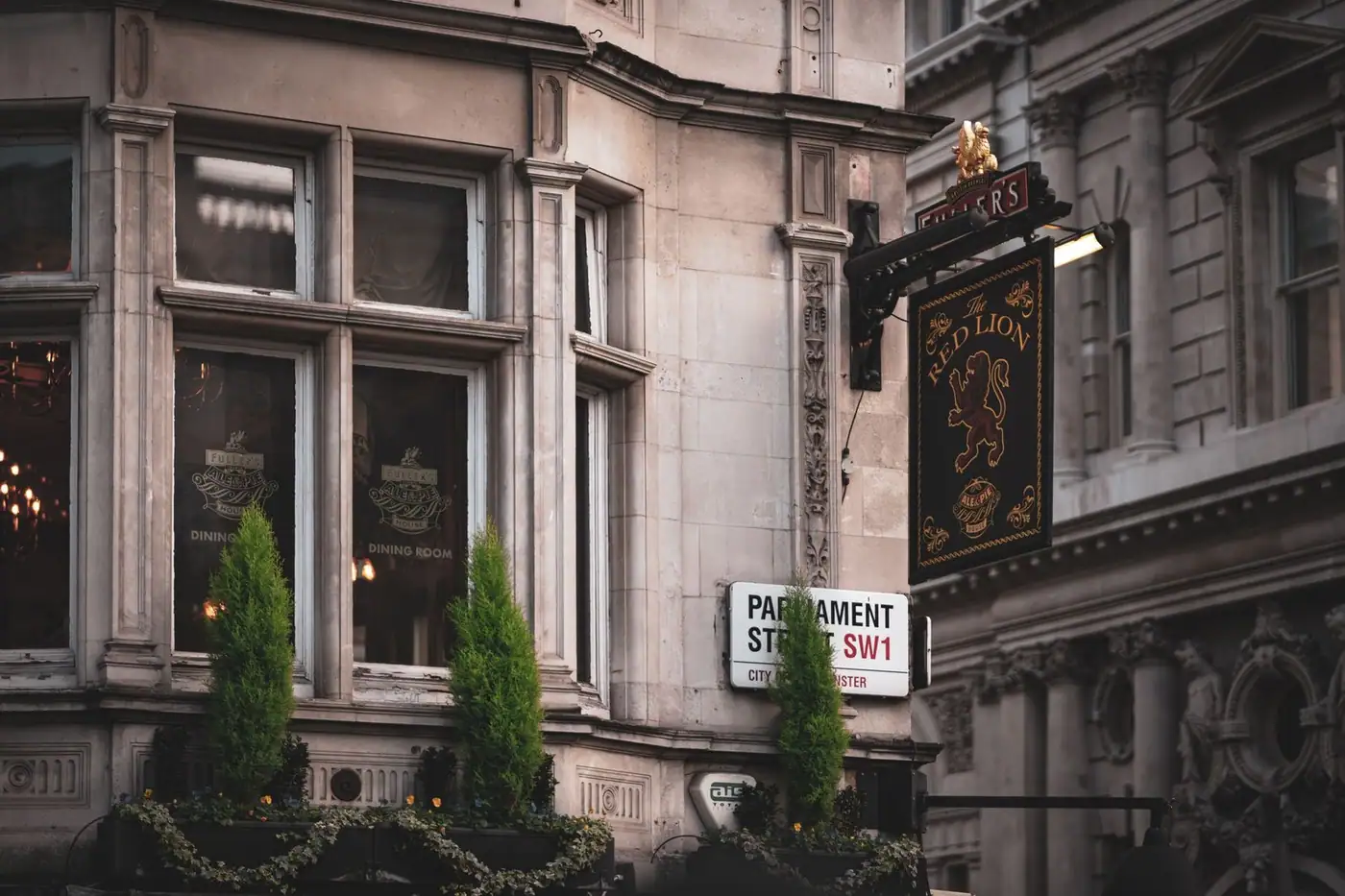 A traditional pub facade in London with classic architecture and detailed signage
