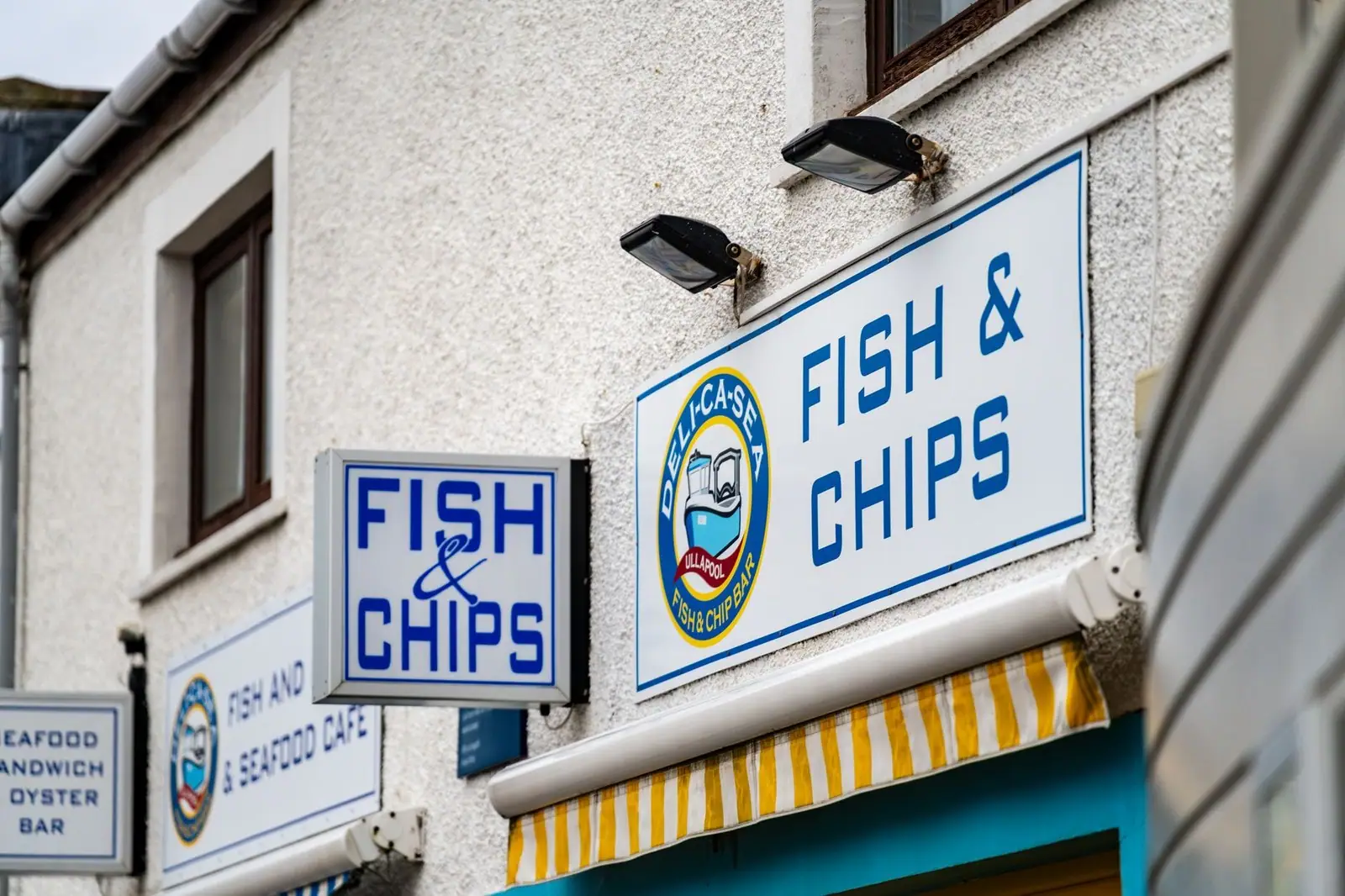 Colorful fish and chips shop facade with signage