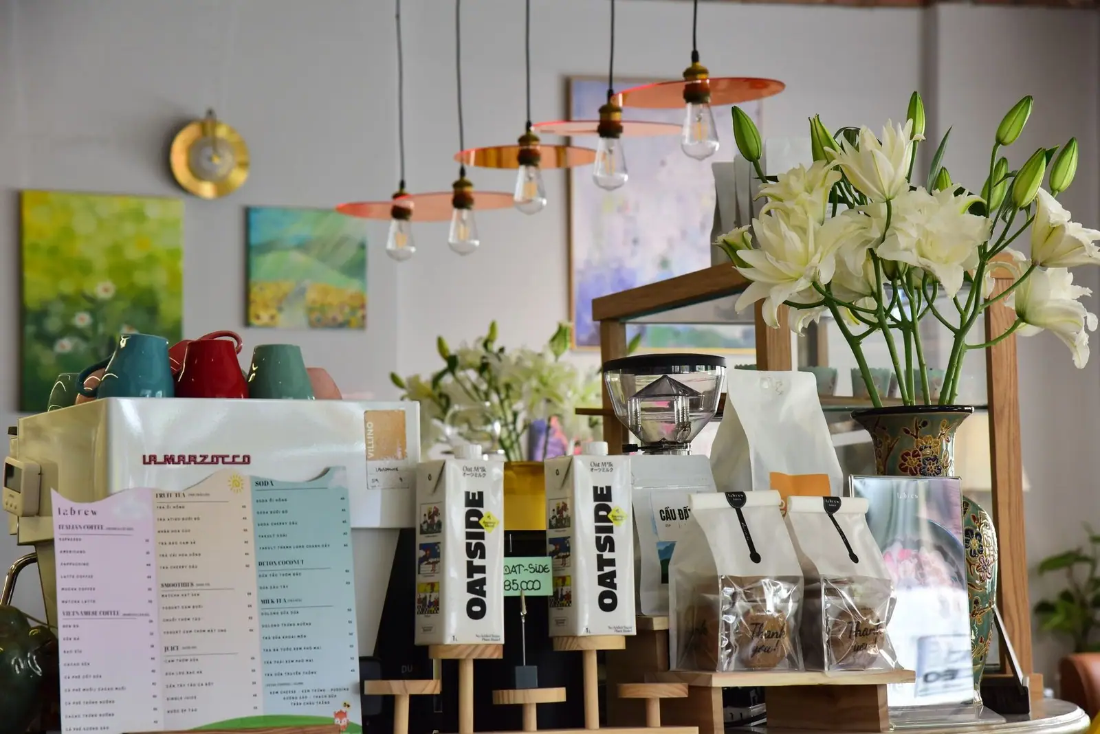 Trendy coffee shop interior featuring flowers and stylish decor creating a cozy ambiance