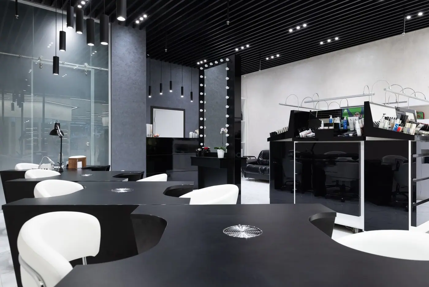 Sleek, elegant salon interior with modern black and white decor, stylish furniture and bright lighting