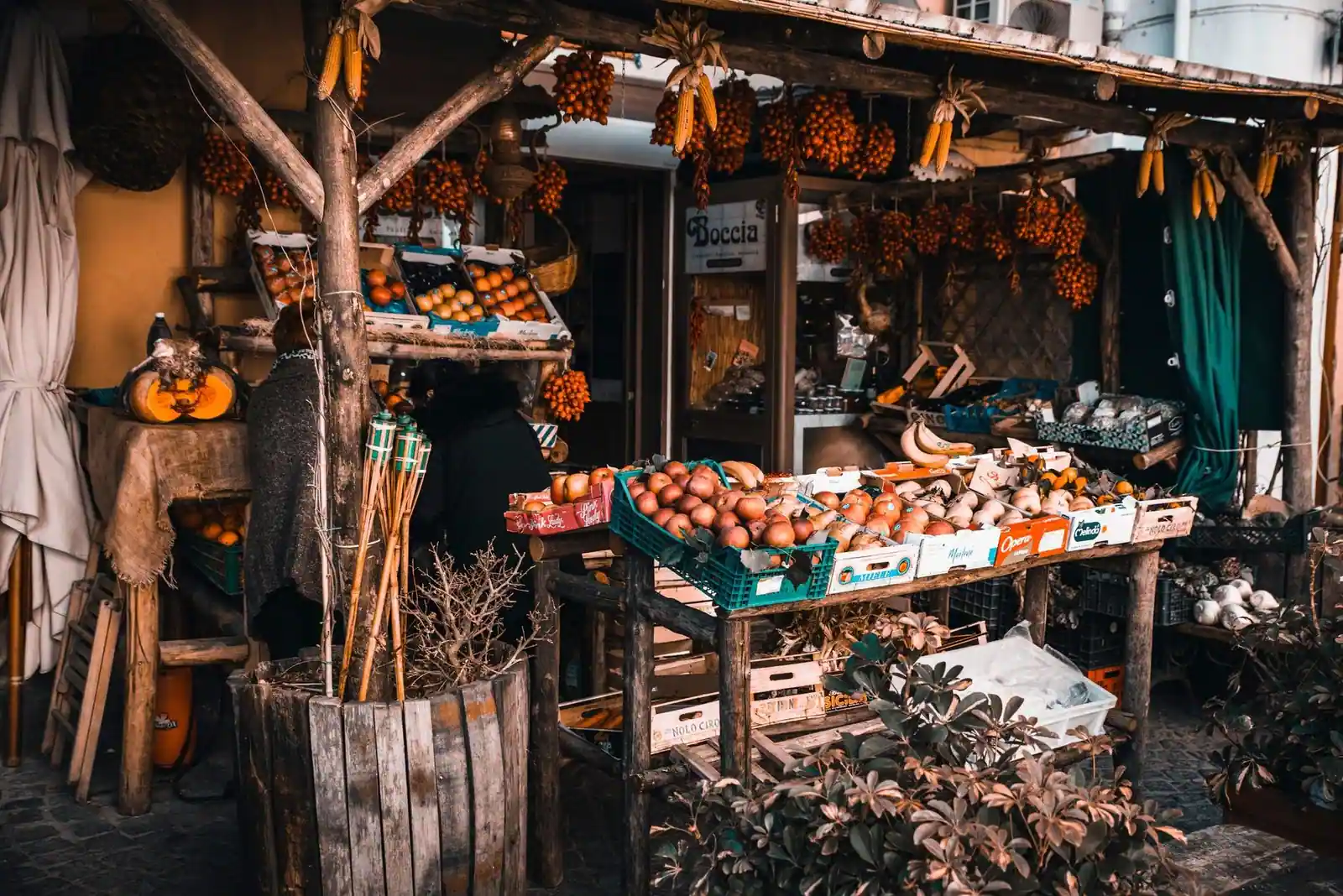Charming rustic fruit stand filled with fresh produce on display outdoors.