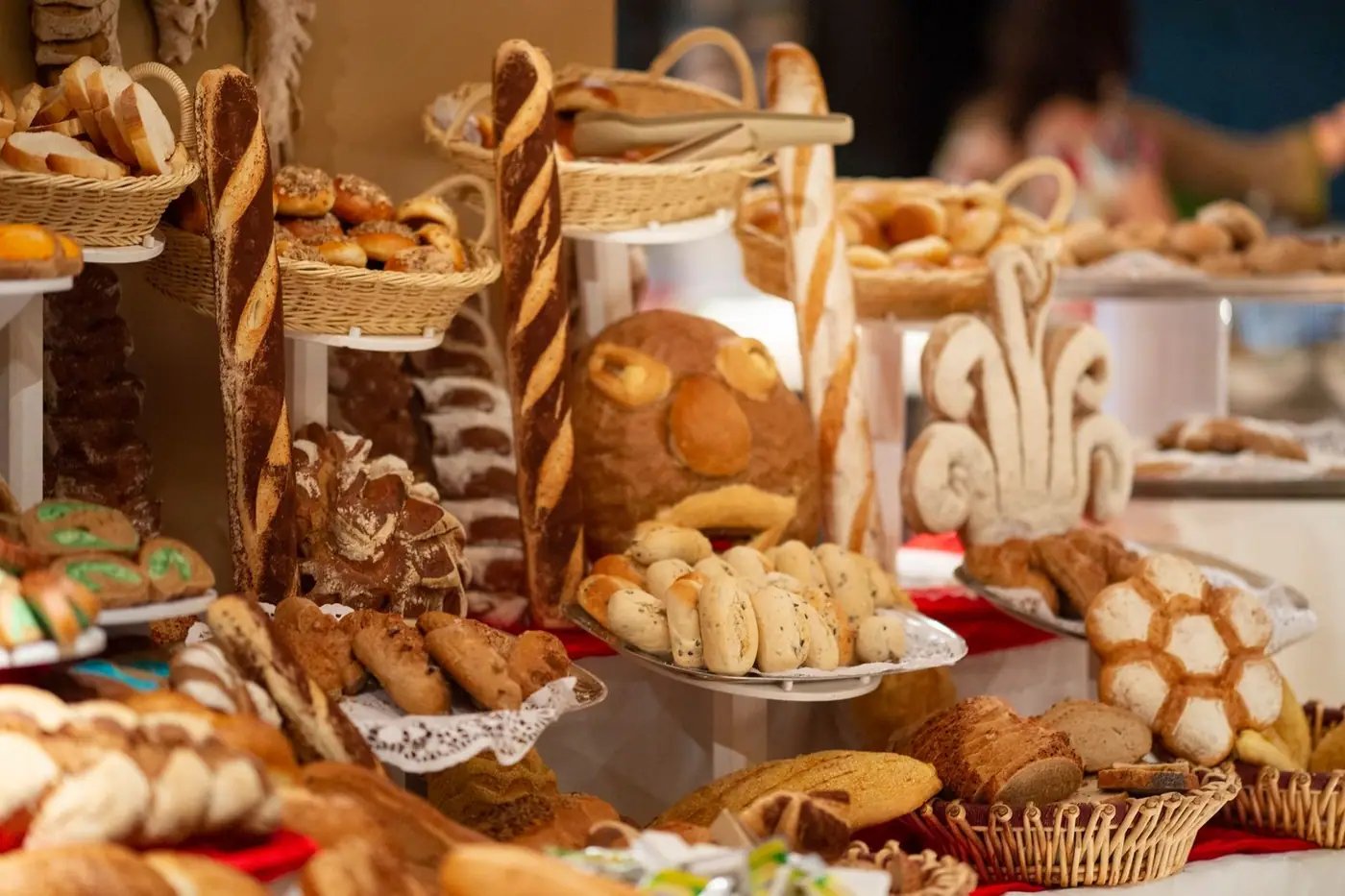 A colourful assortment of artisanal breads and pastries displayed in a bakery