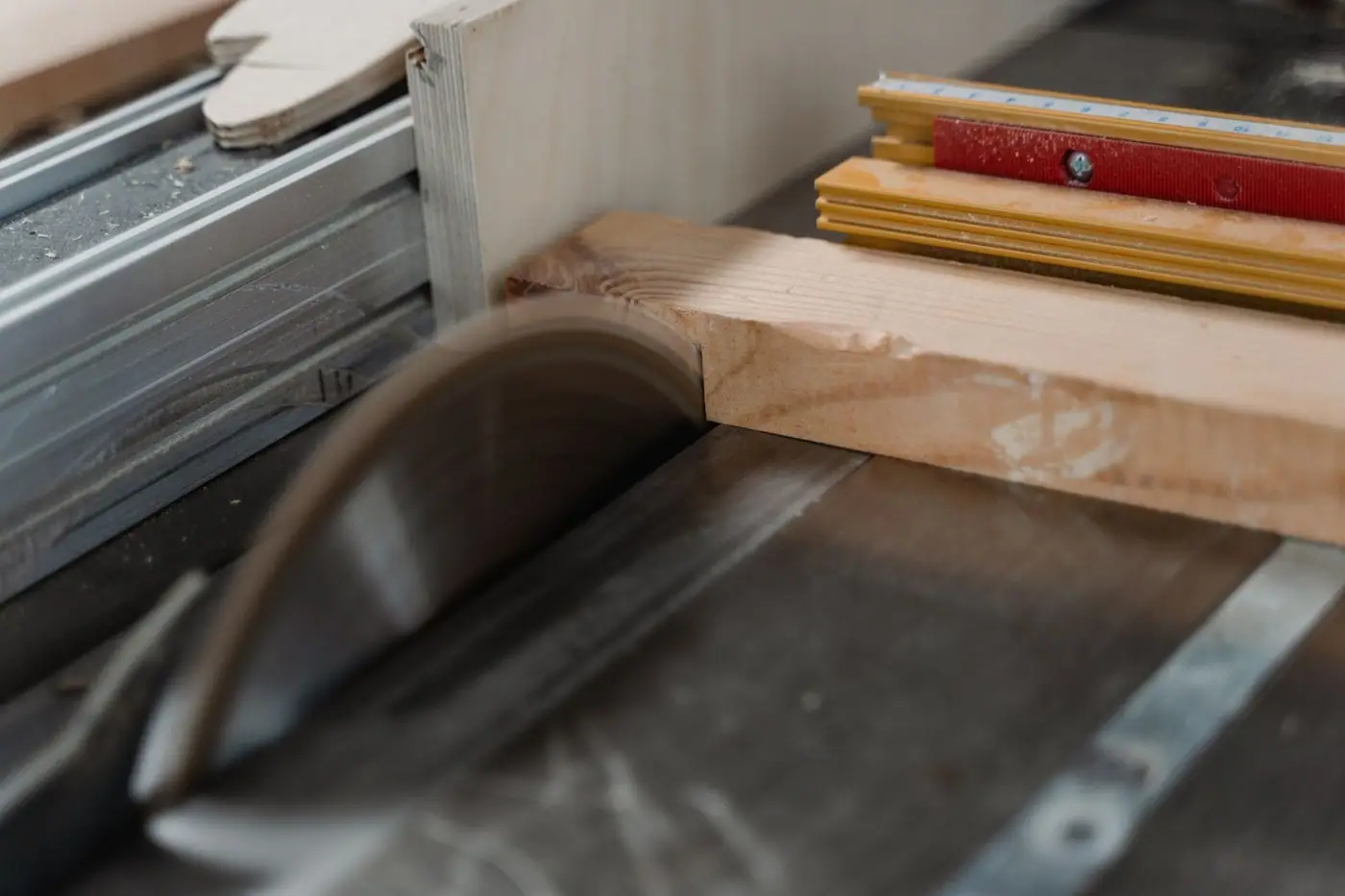 Close-up of a circular saw cutting through timber
