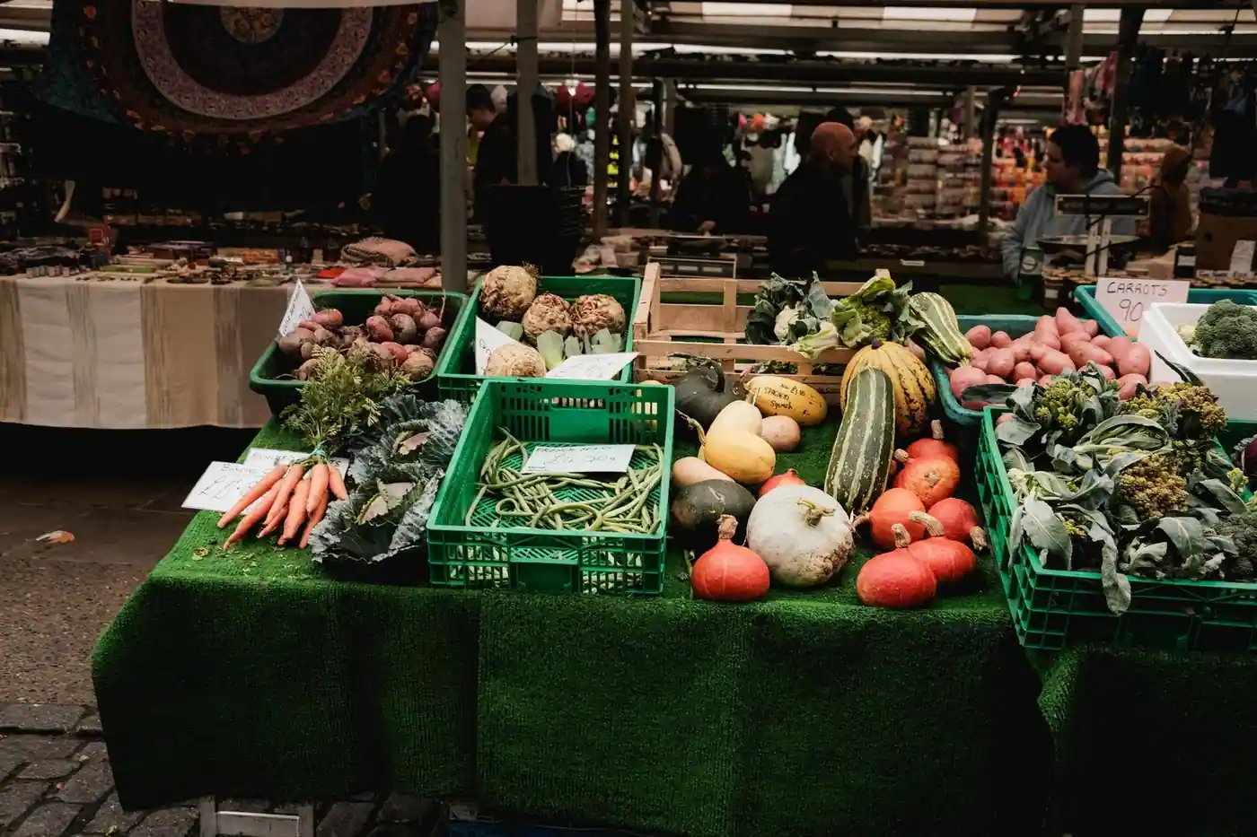 A colourful display of fresh vegetables at a market stall