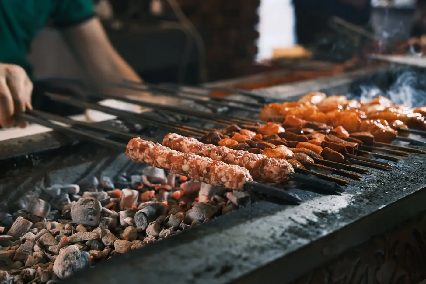 Kebabs grilling over hot coals