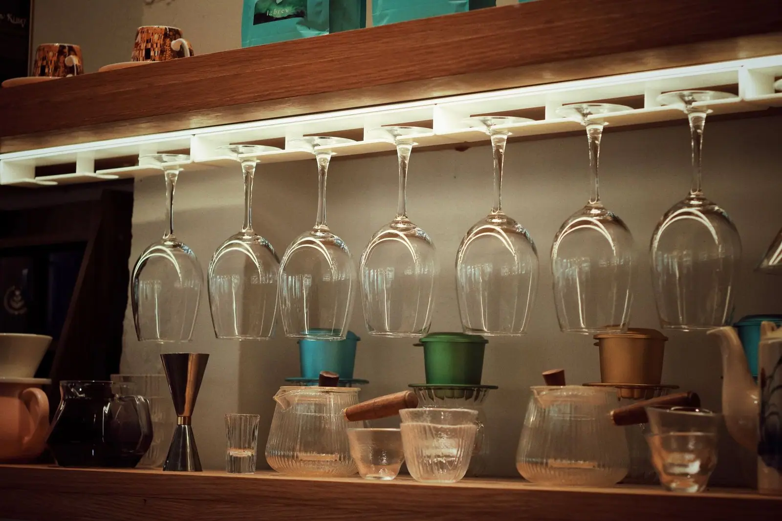 Elegant coffee bar setup with inverted wine glasses and brewing tools