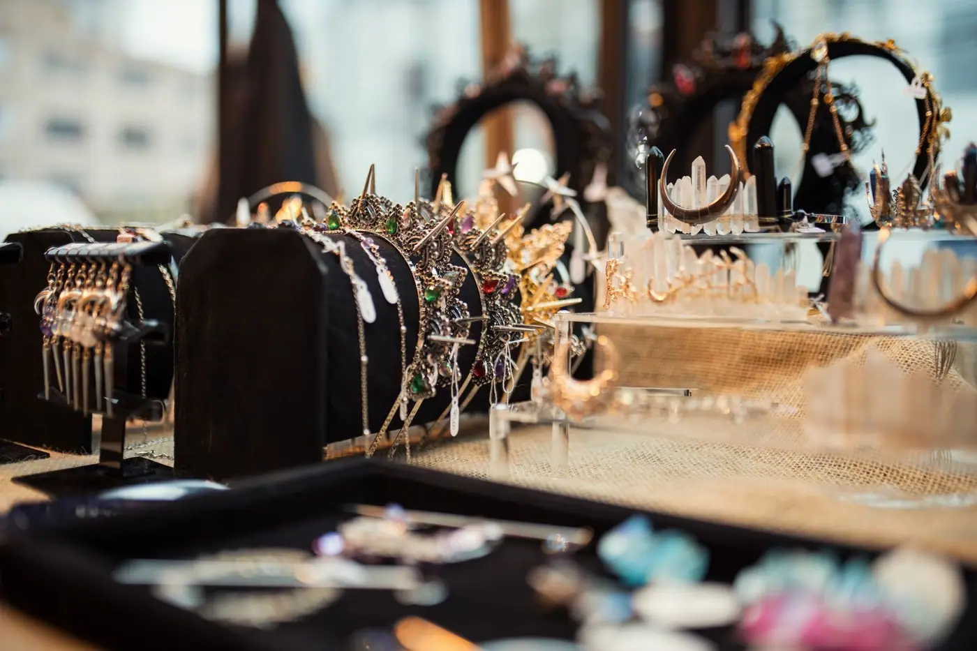 Close-up of a jewellery display with necklaces and crowns