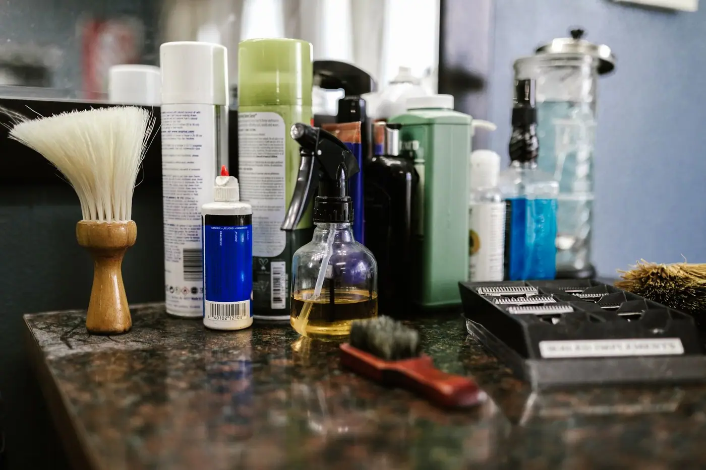 Grooming products and tools on a barbershop countertop