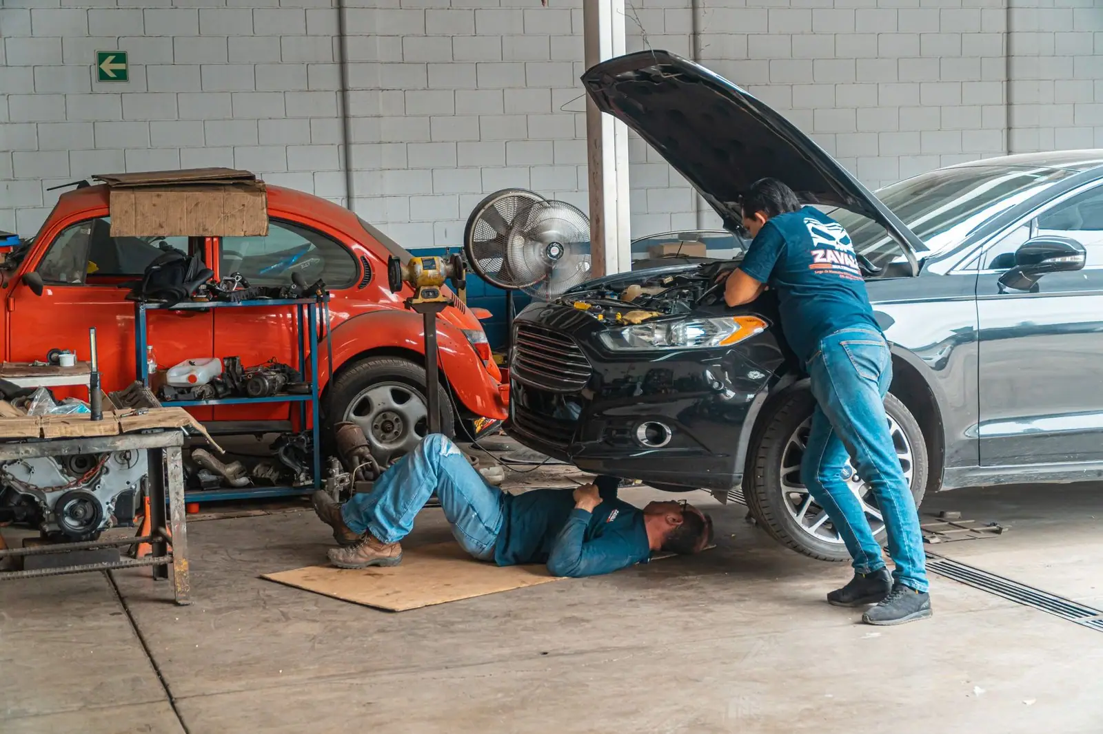 Mechanics working in an automotive workshop