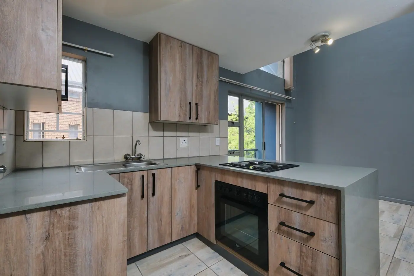 Contemporary kitchen with wood cabinetry and modern appliances