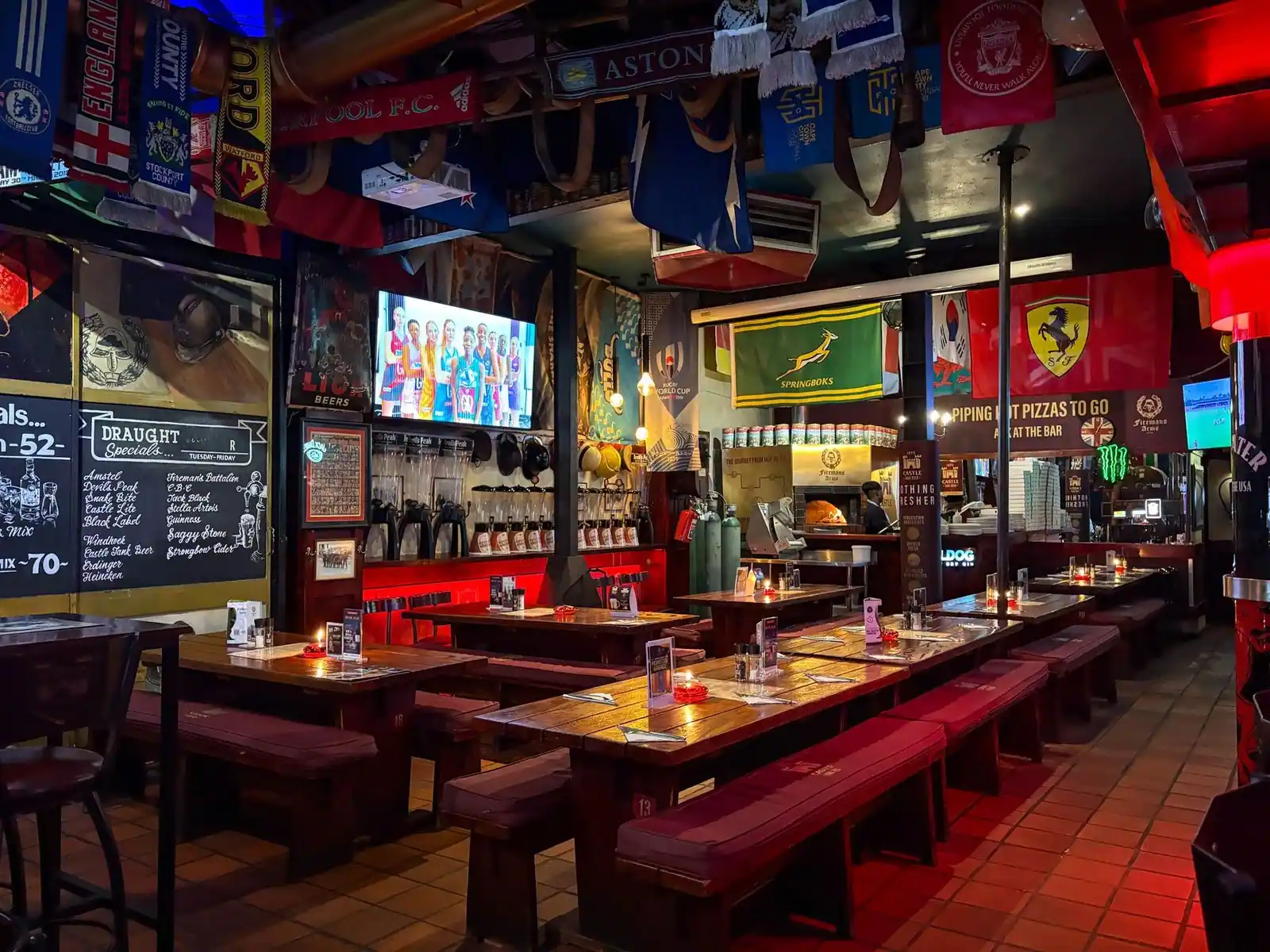 Colorful sports bar with flags and memorabilia in Cape Town