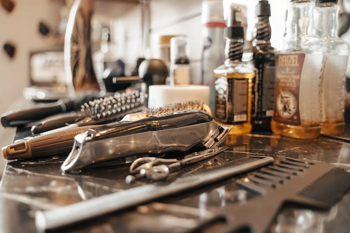Barber tools and grooming products on a workstation