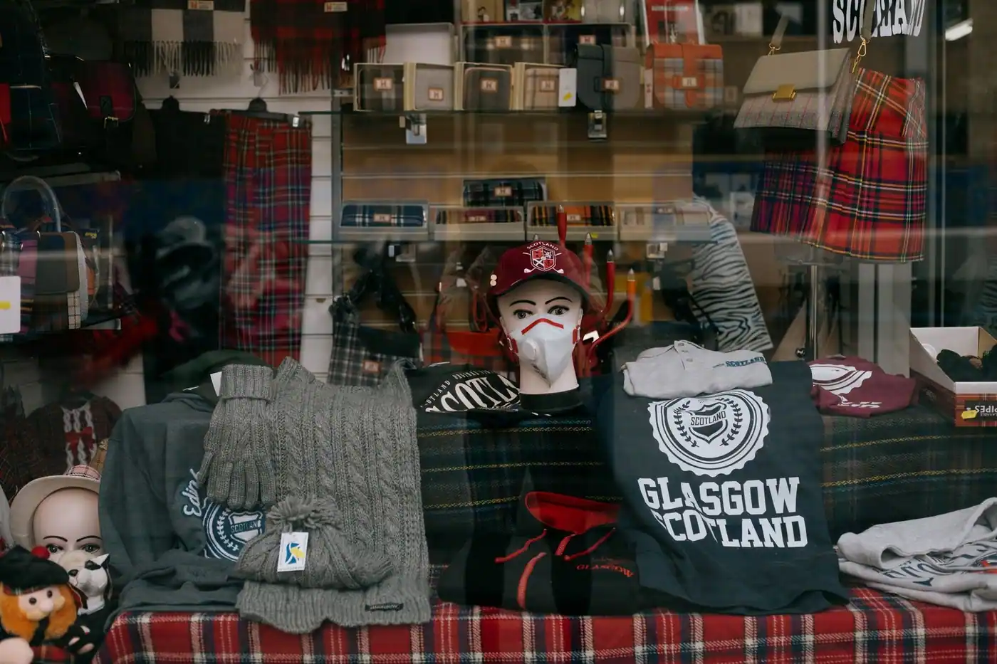 A storefront display in Glasgow showcasing Scottish-themed clothing and accessories