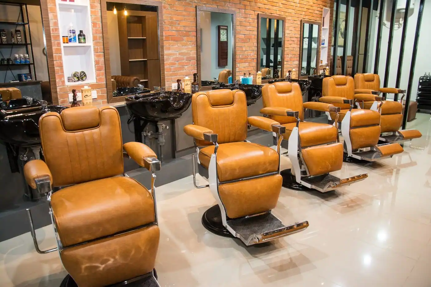 Barbershop interior with modern leather chairs and mirrors