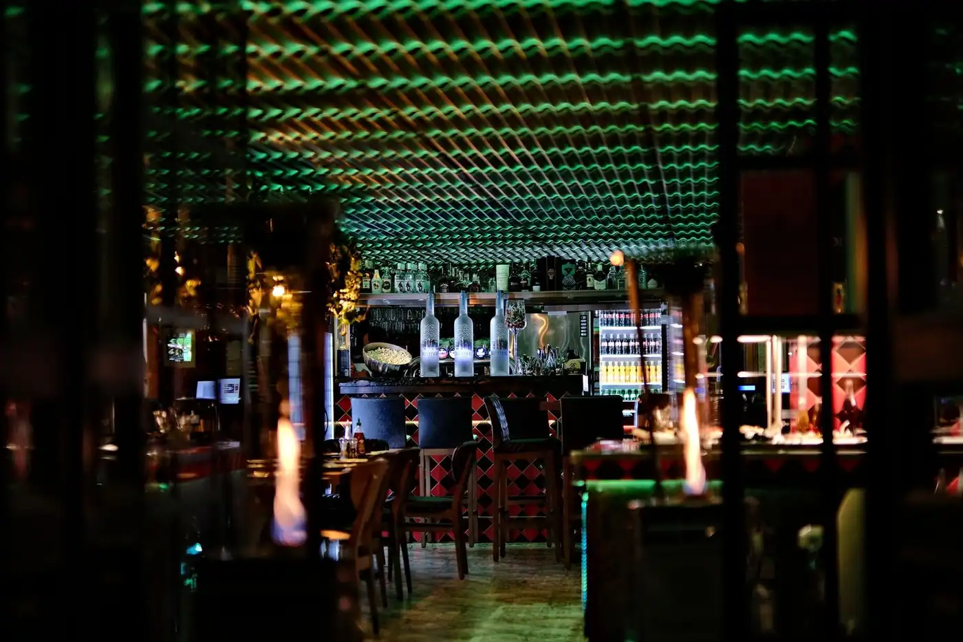 An inviting bar with glowing lights and vibrant decor