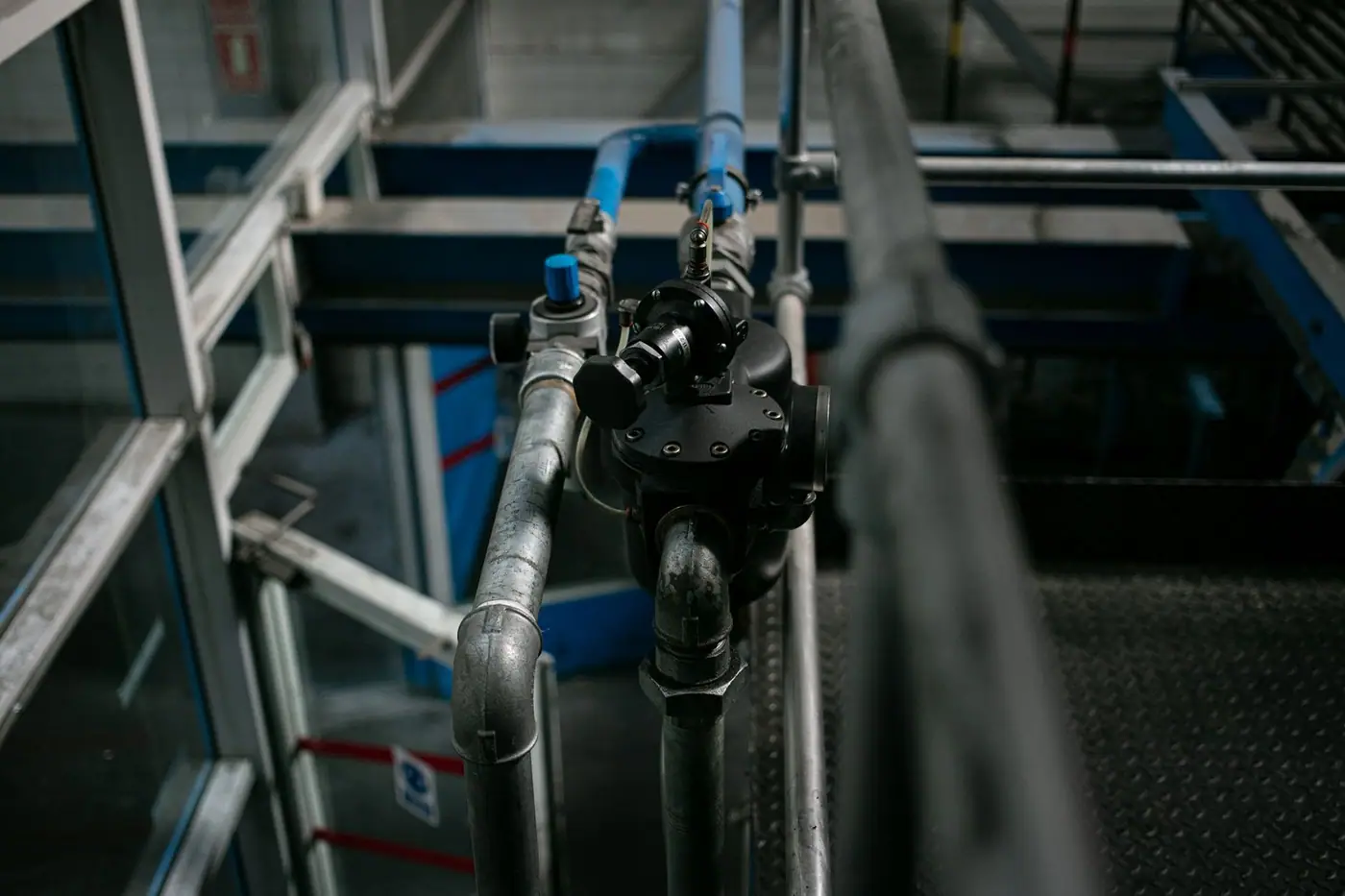 Close-up of a metallic pipe system with valves