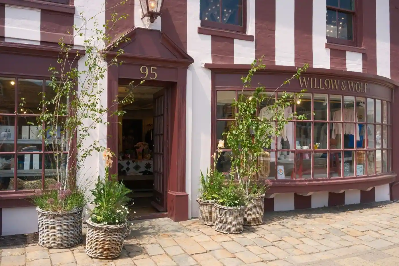 Quaint shopfront with plants in Marlborough, England.