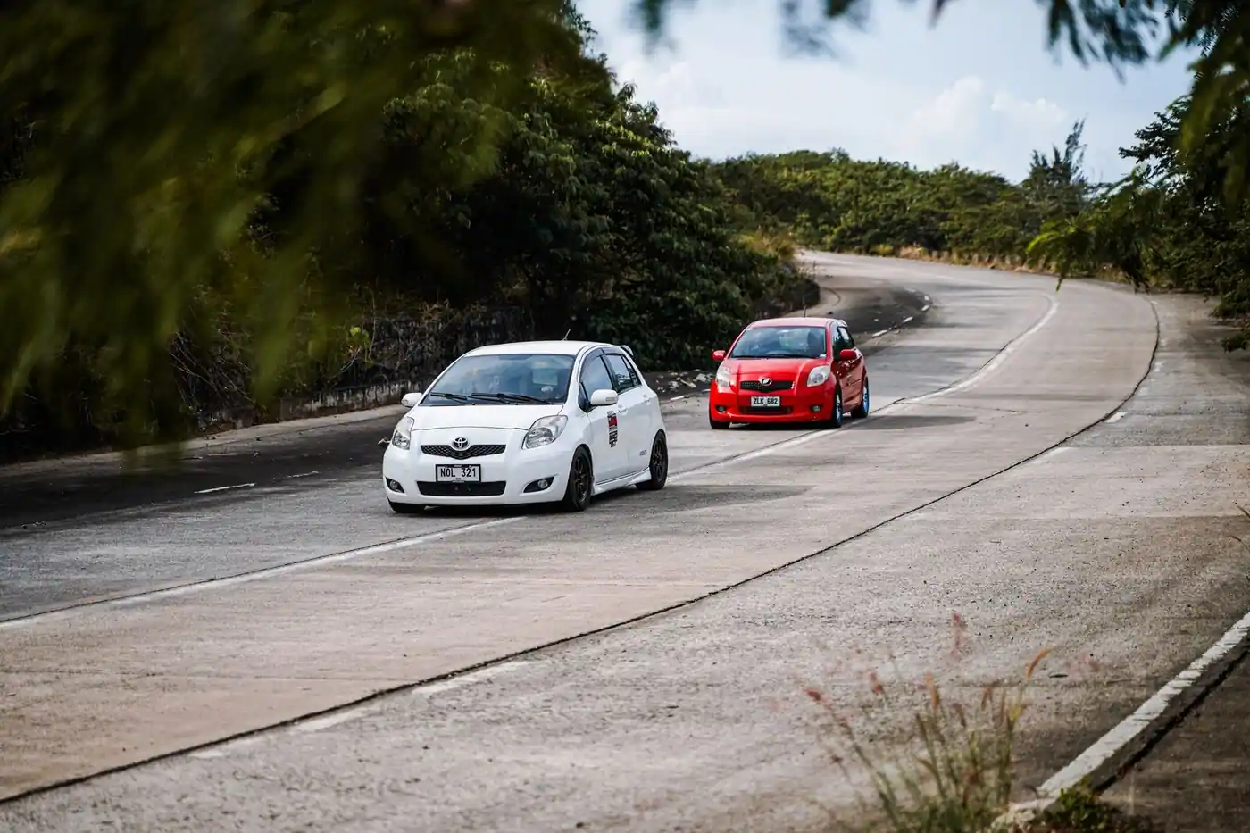Two cars on a curved road