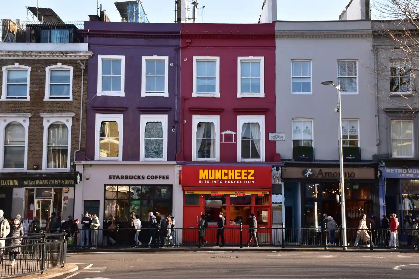 Colourful London street lined with well-known shop signs