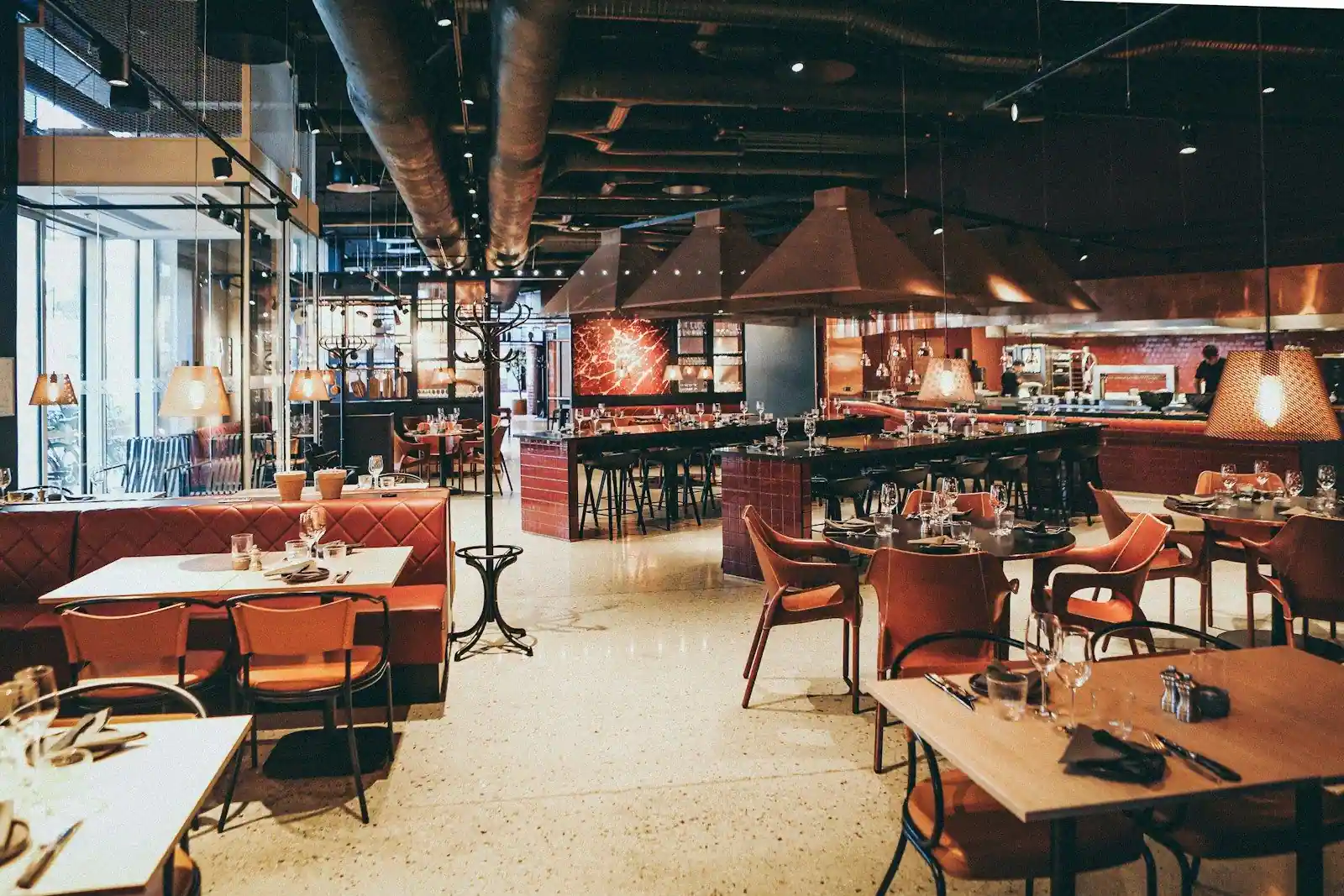 Spacious industrial-style restaurant with exposed ceiling ductwork