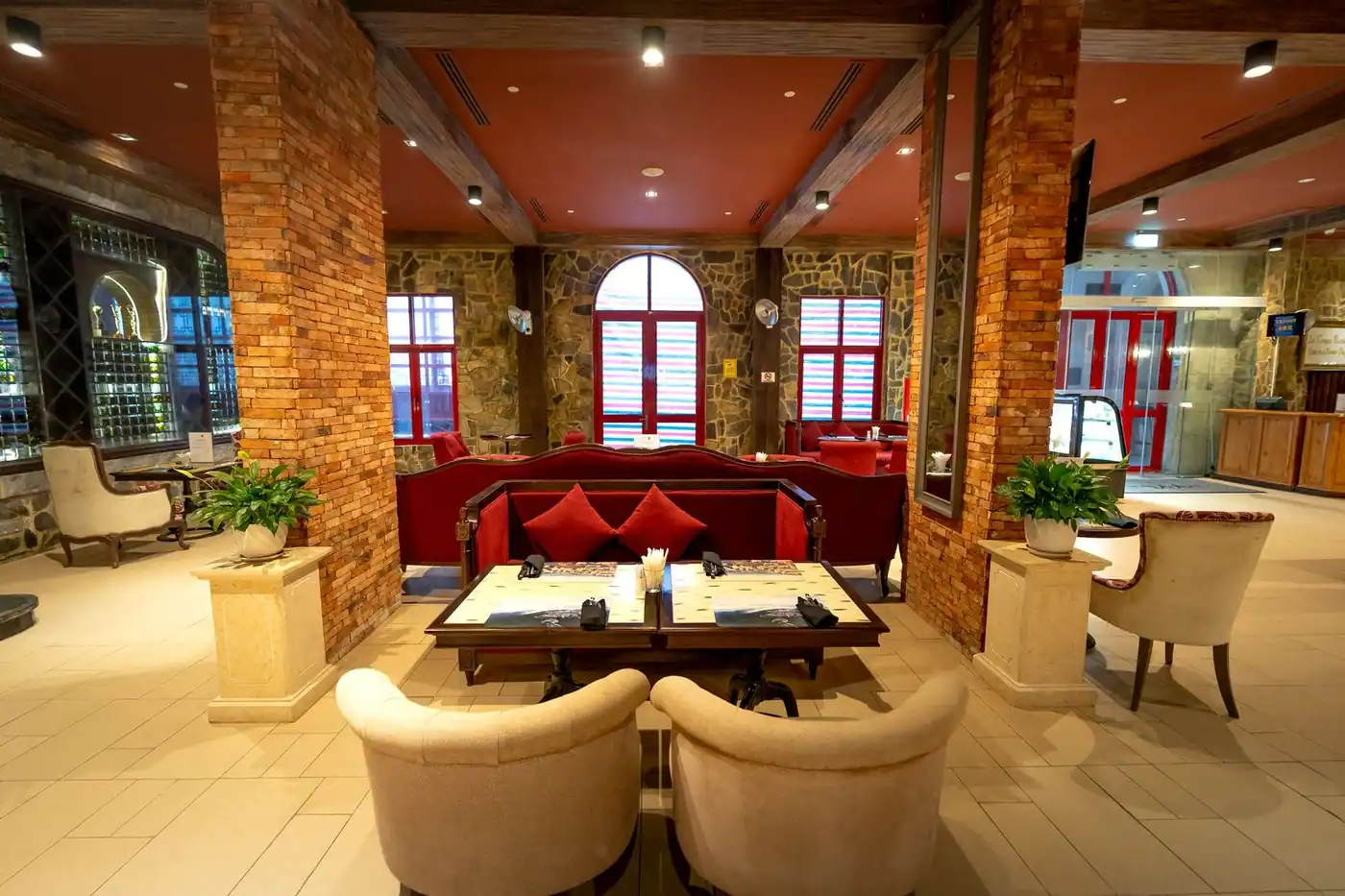 Elegant restaurant interior with stylish seating, warm lighting and decorative elements