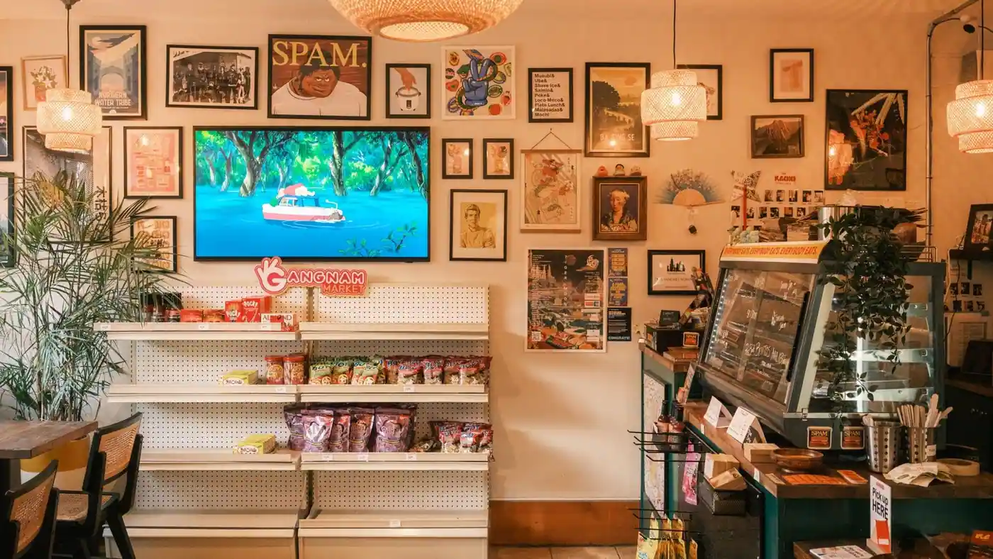 A vibrant market interior with snacks, decor and art pieces on display