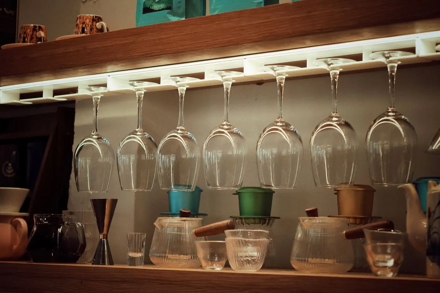 A coffee bar set up with inverted glasses and brewing tools