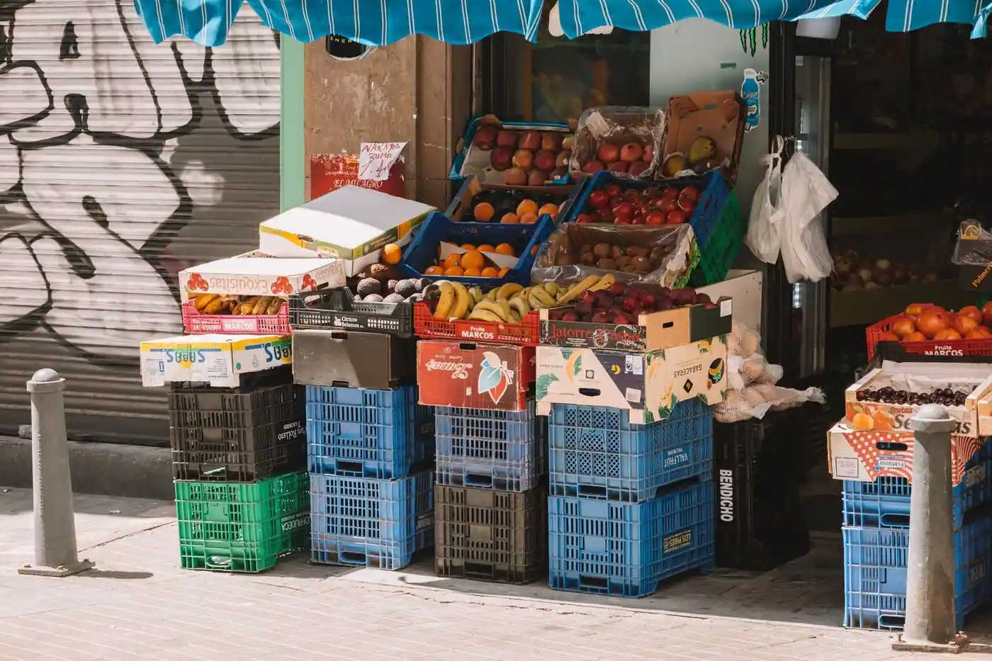 A colourful fruit stand on a sunny street market