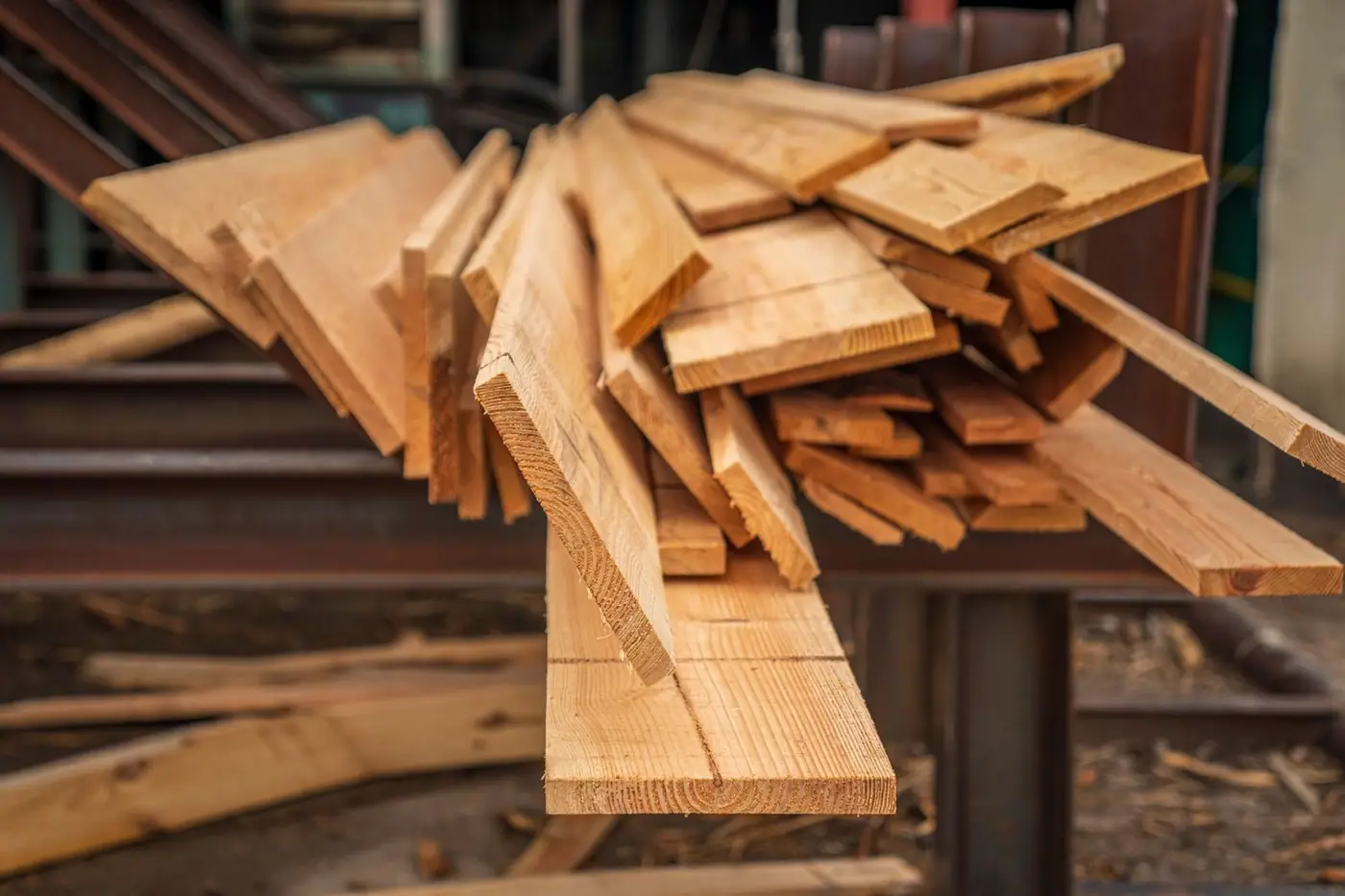 Close-up of stacked hardwood lumber in a carpentry workshop